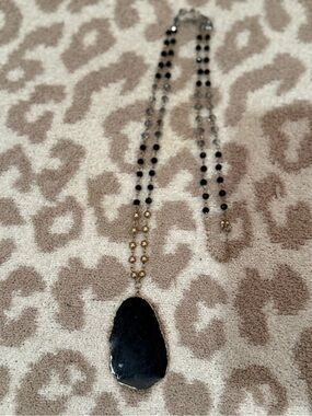 Elegant Black Stone Pendant Necklace with Gold Accents